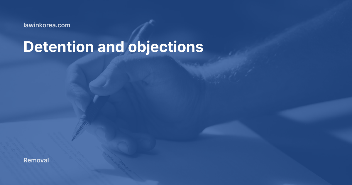 Hand signing a document with a blue pen: Held by Immigration in Korea? Detention Review, Deportation Objection and Temporary Release