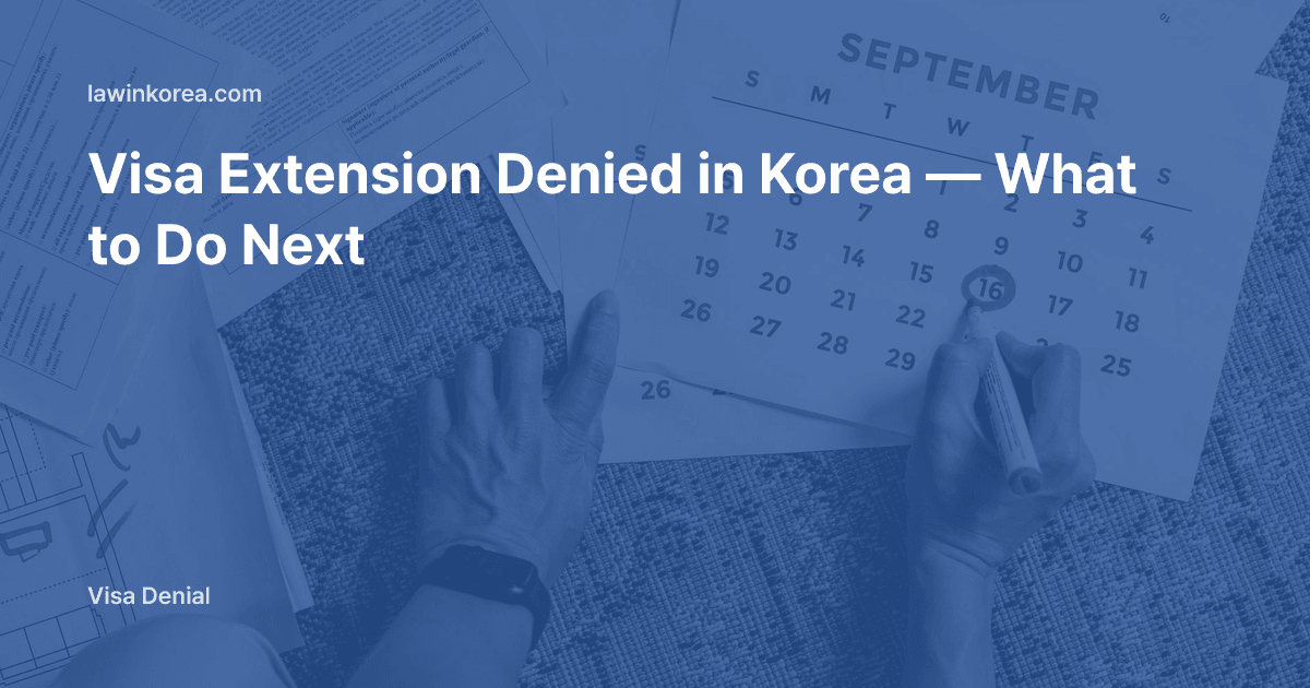 Photo of hands marking a deadline on a calendar over documents: Visa Extension Denied in Korea — What to Do Next